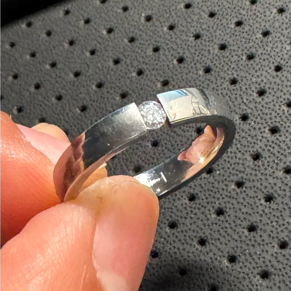 Stainless steel band with stone.